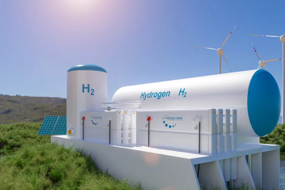 3D rendering of a hydrogen storage facility with wind turbines in background
